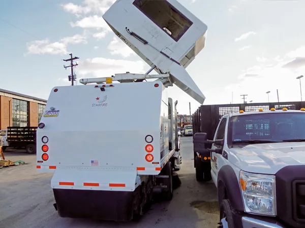Starfire S-4c high dump hopper unloading debris