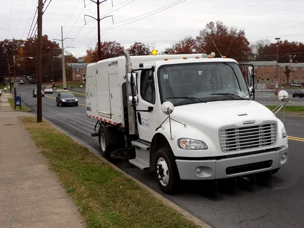 Starfire S-4XXL mechanical broom sweeper sweeping along a street